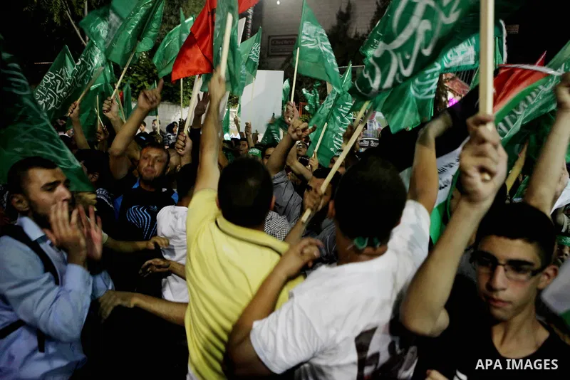 Palestinians celebrate what they said was a victory by Palestinians in Gaza over Israel following a ceasefire, in the West Bank city of Ramallah August 26, 2014. A ceasefire agreement between Israel and the Palestinians...