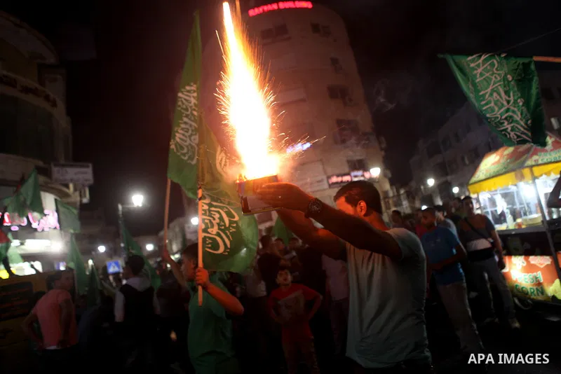 Palestinians celebrate what they said was a victory by Palestinians in Gaza over Israel following a ceasefire, in the West Bank city of Ramallah August 26, 2014. A ceasefire agreement between Israel and the Palestinians...