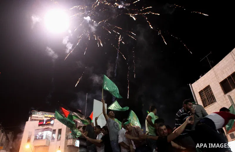 Palestinians celebrate what they said was a victory by Palestinians in Gaza over Israel following a ceasefire, in the West Bank city of Ramallah August 26, 2014. A ceasefire agreement between Israel and the Palestinians...