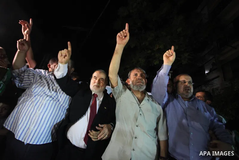 Senior Hamas leader Mahmoud Al-Zahar, appearing for the first time since the start of a seven-week conflict, speaks during a rally by Palestinians celebrating what they said was a victory over Israel, following a ceasefi...