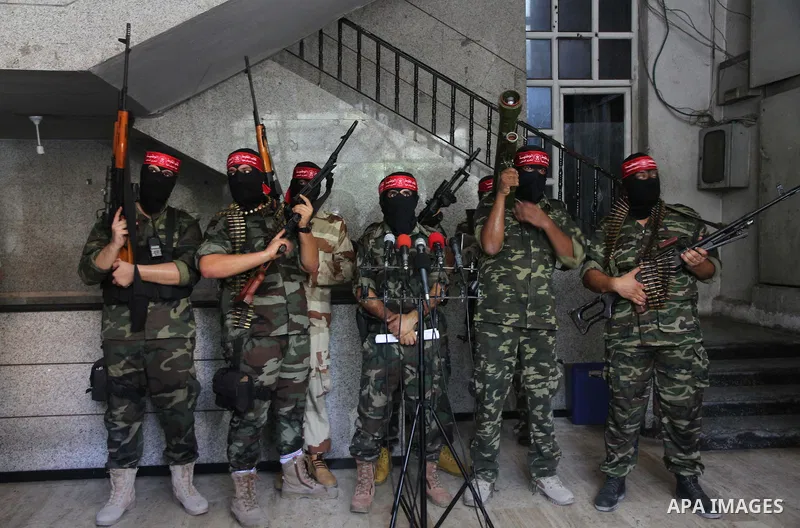 Palestinian Militants from the Democratic Front for the Liberation of Palestine (DFLP) speak a press conference in Gaza city on August 27, 2014. Palestinian President Mahmoud Abbas announced on 26 August 2014 an Egyptian...