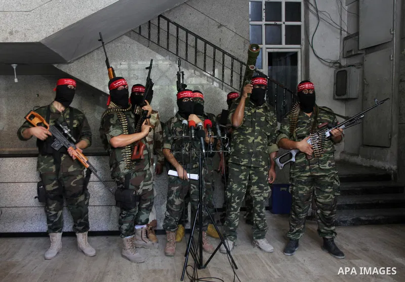 Palestinian Militants from the Democratic Front for the Liberation of Palestine (DFLP) speak a press conference in Gaza city on August 27, 2014. Palestinian President Mahmoud Abbas announced on 26 August 2014 an Egyptian...