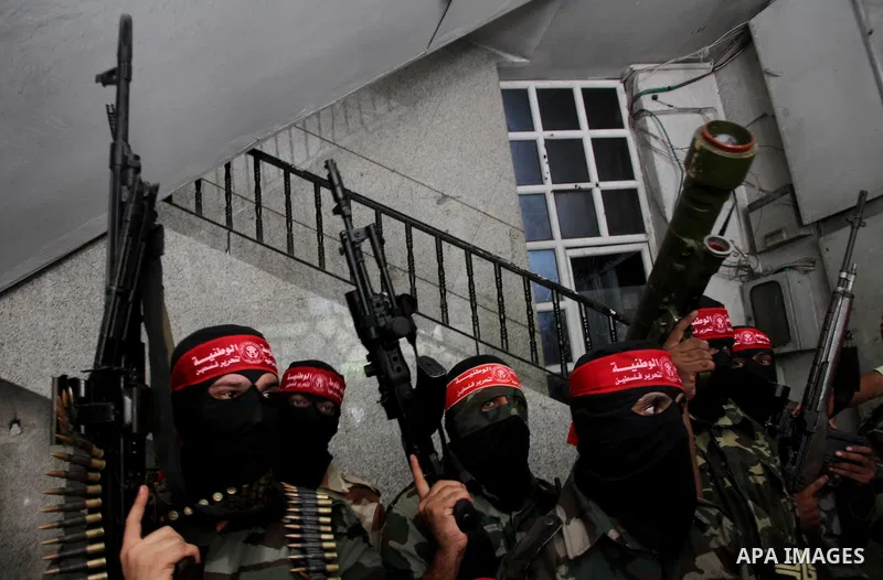 Palestinian Militants from the Democratic Front for the Liberation of Palestine (DFLP) speak a press conference in Gaza city on August 27, 2014. Palestinian President Mahmoud Abbas announced on 26 August 2014 an Egyptian...