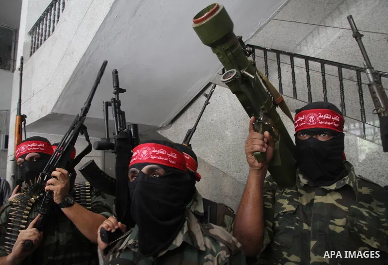 Palestinian Militants from the Democratic Front for the Liberation of Palestine (DFLP) speak a press conference in Gaza city on August 27, 2014. Palestinian President Mahmoud Abbas announced on 26 August 2014 an Egyptian...