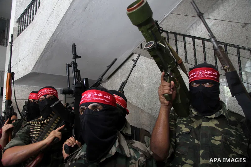 Palestinian Militants from the Democratic Front for the Liberation of Palestine (DFLP) speak a press conference in Gaza city on August 27, 2014. Palestinian President Mahmoud Abbas announced on 26 August 2014 an Egyptian...