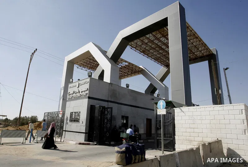 Palestinians, hoping to cross into Egypt, wait at the Rafah border crossing with Egypt in the southern Gaza Strip city of Rafha, on August 27, 2014. The open-ended ceasefire in the Gaza war between Israel and the Palesti...