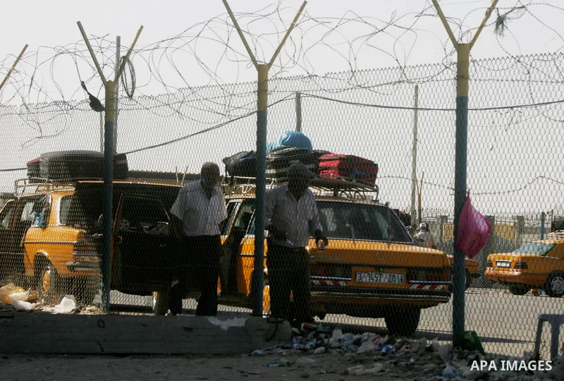 Palestinians, hoping to cross into Egypt, wait at the Rafah border crossing with Egypt in the southern Gaza Strip city of Rafha, on August 27, 2014. The open-ended ceasefire in the Gaza war between Israel and the Palesti...