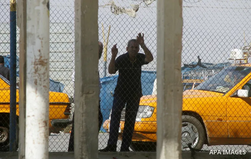Palestinians, hoping to cross into Egypt, wait at the Rafah border crossing with Egypt in the southern Gaza Strip city of Rafha, on August 27, 2014. The open-ended ceasefire in the Gaza war between Israel and the Palesti...