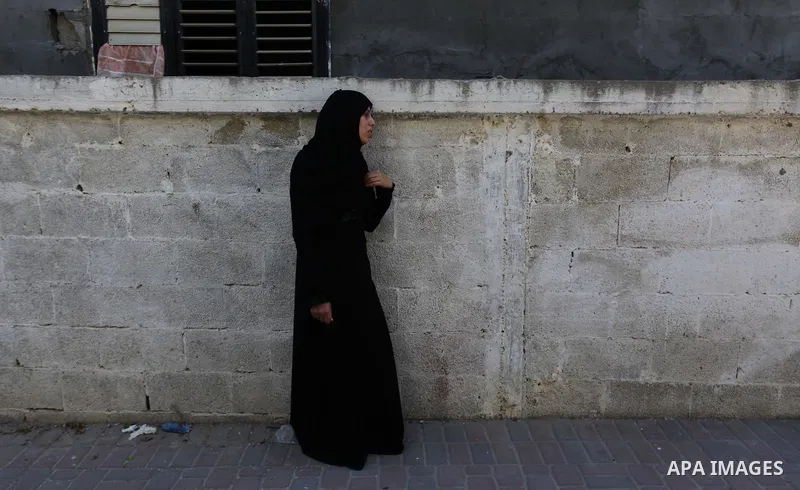 A Relative of two Palestinian children Mohammed and Omar al-Brim, who witnesses said were killed in an Israeli air strike before a ceasefire was declared, mourns during their funeral in Khan Younis in the southern Gaza S...