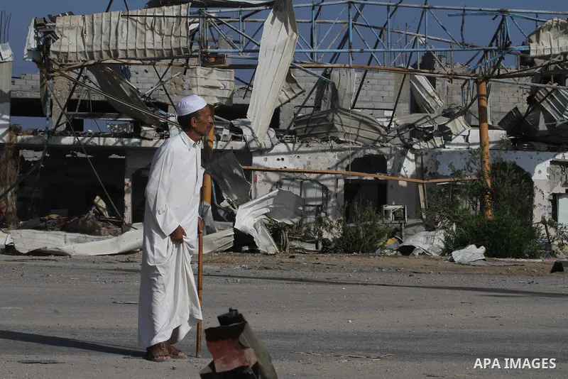 A Palestinian elderly man walks in a street on August 27, 2014 among houses destroyed in Gaza City's Shejaiya neighbourhood, which was one of the hardest hit hit by the fighting between Israel and Hamas militants. The op...