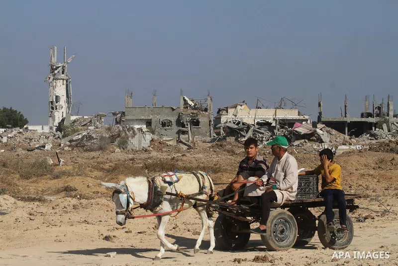 Palestinians return to their homes in Gaza City on August 27, 2014, following the long-term truce agreed between Israel and the Palestinians. The open-ended ceasefire in the Gaza war between Israel and the Palestinians h...