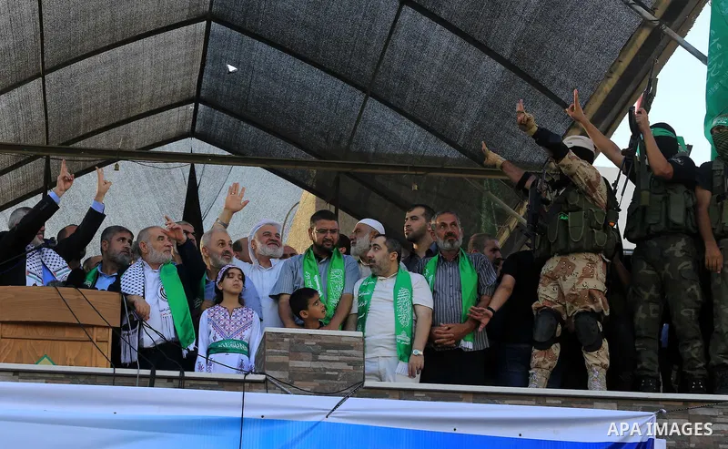 Hamas top leader in the Gaza Strip Ismail Haniya waves to the crowd during a rally in Gaza City on August 27, 2014, following a deal hailed by Israel and the Islamist movement as 'victory' in the 50-day war. The agreemen...