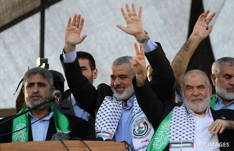 Hamas top leader in the Gaza Strip Ismail Haniya waves to the crowd during a rally in Gaza City on August 27, 2014, following a deal hailed by Israel and the Islamist movement as 'victory' in the 50-day war. The agreemen...