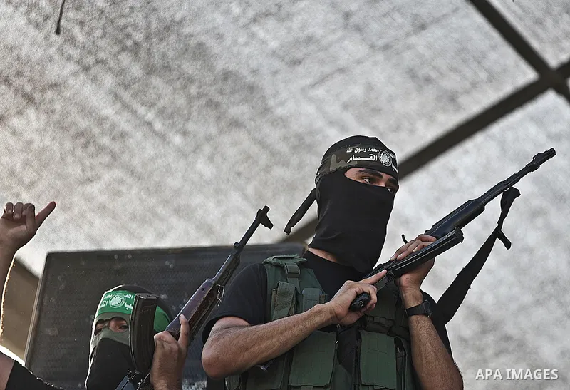 Palestinian militants from the Ezzedine al-Qassam Brigades, Hamas' armed wing, attend a rally in Gaza City on August 27, 2014, following a deal hailed by Israel and the Islamist movement as 'victory' in the 50-day war. T...