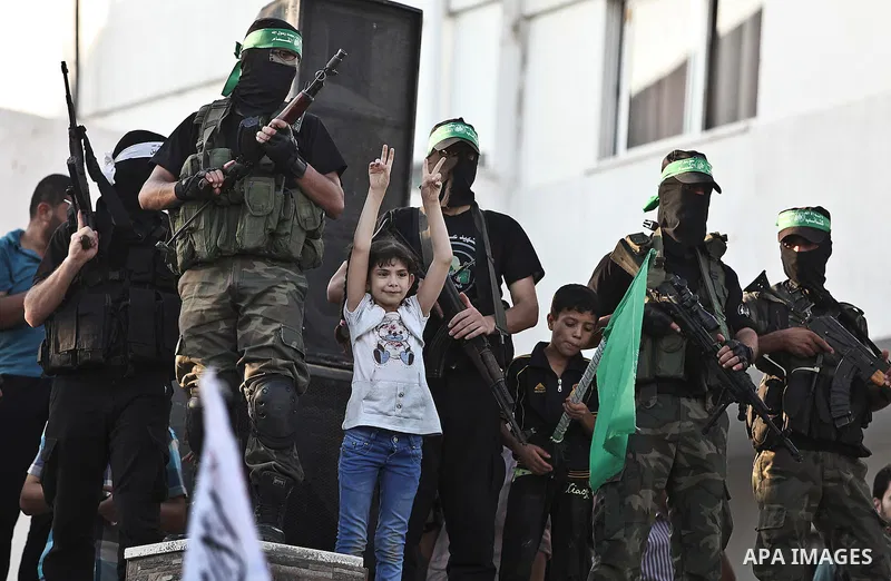 Palestinian militants from the Ezzedine al-Qassam Brigades, Hamas' armed wing, attend a rally in Gaza City on August 27, 2014, following a deal hailed by Israel and the Islamist movement as 'victory' in the 50-day war. T...