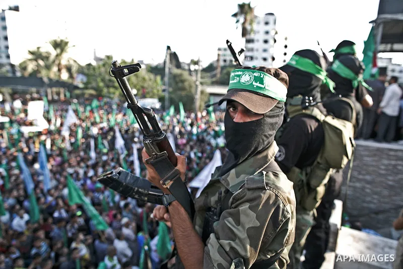 Palestinian militants from the Ezzedine al-Qassam Brigades, Hamas' armed wing, attend a rally in Gaza City on August 27, 2014, following a deal hailed by Israel and the Islamist movement as 'victory' in the 50-day war. T...