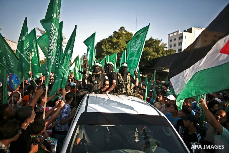 Palestinian militants from the Ezzedine al-Qassam Brigades, Hamas' armed wing, attend a rally in Gaza City on August 27, 2014, following a deal hailed by Israel and the Islamist movement as 'victory' in the 50-day war. T...