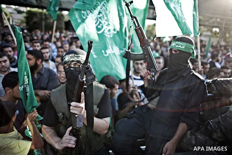 Palestinian militants from the Ezzedine al-Qassam Brigades, Hamas' armed wing, attend a rally in Gaza City on August 27, 2014, following a deal hailed by Israel and the Islamist movement as 'victory' in the 50-day war. T...