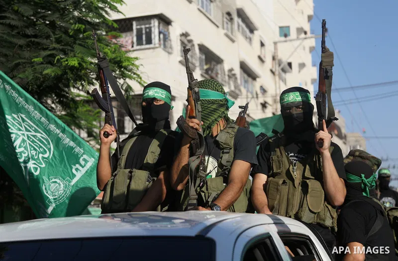 Palestinian militants from the Ezzedine al-Qassam Brigades, Hamas' armed wing, take part in a rally in Gaza City on August 27, 2014, following a deal hailed by Israel and the Islamist movement as 'victory' in the 50-day...