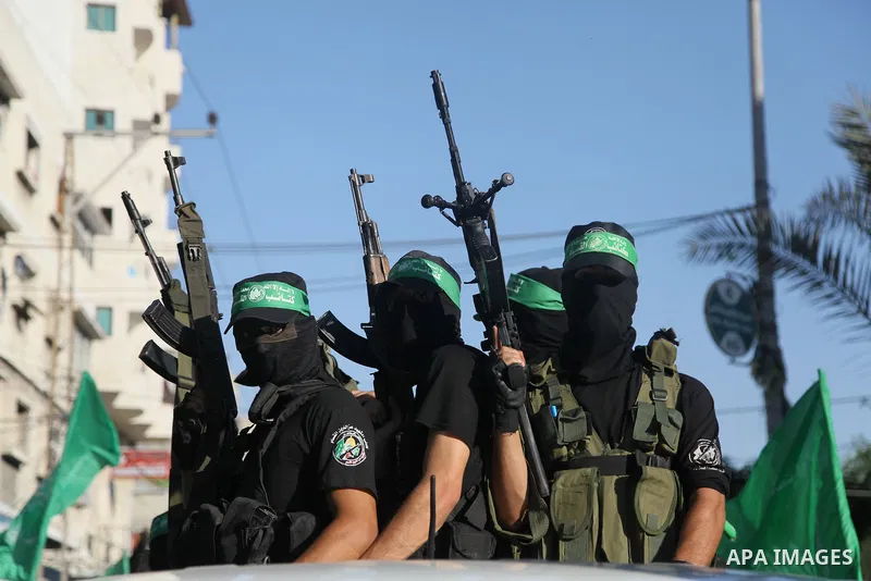 Palestinian militants from the Ezzedine al-Qassam Brigades, Hamas' armed wing, take part in a rally in Gaza City on August 27, 2014, following a deal hailed by Israel and the Islamist movement as 'victory' in the 50-day...