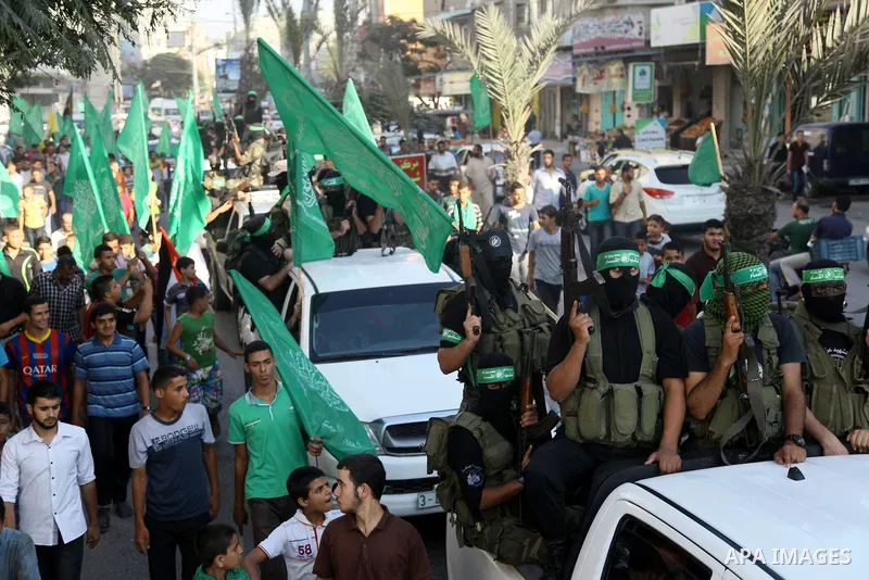 Palestinians Hamas supporters celebrate with people a victory over Israel, in Gaza City August 27, 2014. An open-ended ceasefire in the Gaza war held on Wednesday as Prime Minister Benjamin Netanyahu faced strong critici...