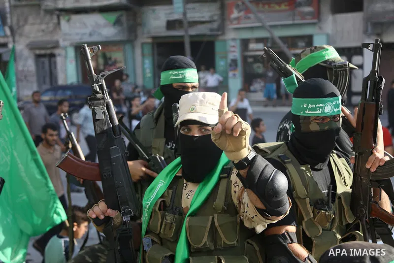 Palestinian militants from the Ezzedine al-Qassam Brigades, Hamas' armed wing, take part in a rally in Gaza City on August 27, 2014, following a deal hailed by Israel and the Islamist movement as 'victory' in the 50-day...