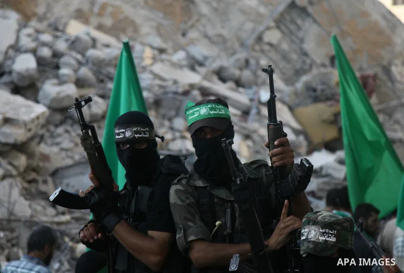 Palestinian militants from the Ezzedine al-Qassam Brigades, Hamas' armed wing, take part in a rally in Gaza City on August 27, 2014, following a deal hailed by Israel and the Islamist movement as 'victory' in the 50-day...