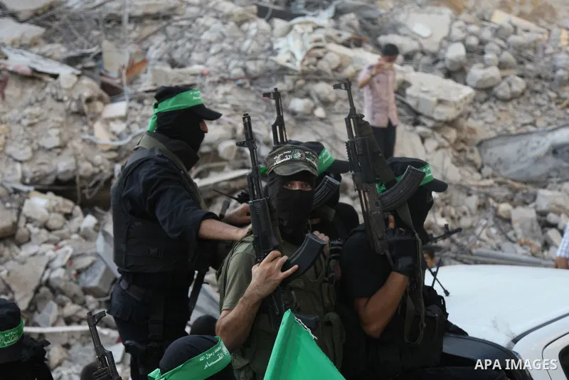 Palestinian militants from the Ezzedine al-Qassam Brigades, Hamas' armed wing, take part in a rally in Gaza City on August 27, 2014, following a deal hailed by Israel and the Islamist movement as 'victory' in the 50-day...