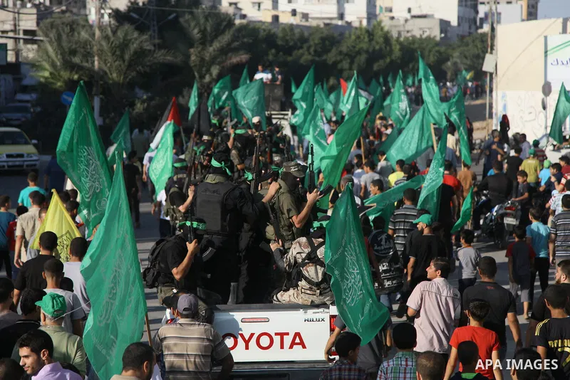 Palestinians Hamas supporters celebrate with people a victory over Israel, in Gaza City August 27, 2014. An open-ended ceasefire in the Gaza war held on Wednesday as Prime Minister Benjamin Netanyahu faced strong critici...