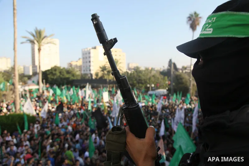 Palestinian militants from the Ezzedine al-Qassam Brigades, Hamas' armed wing, attend a rally in Gaza City on August 27, 2014, following a deal hailed by Israel and the Islamist movement as 'victory' in the 50-day war. T...