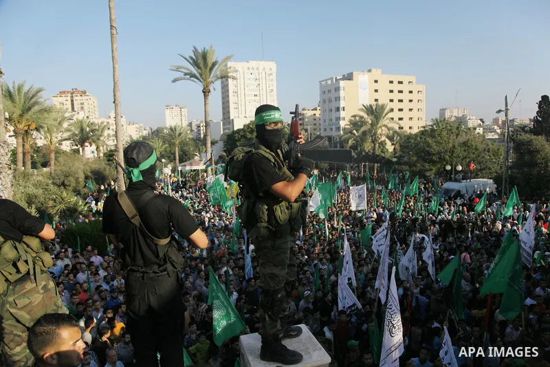 Palestinian militants from the Ezzedine al-Qassam Brigades, Hamas' armed wing, attend a rally in Gaza City on August 27, 2014, following a deal hailed by Israel and the Islamist movement as 'victory' in the 50-day war. T...