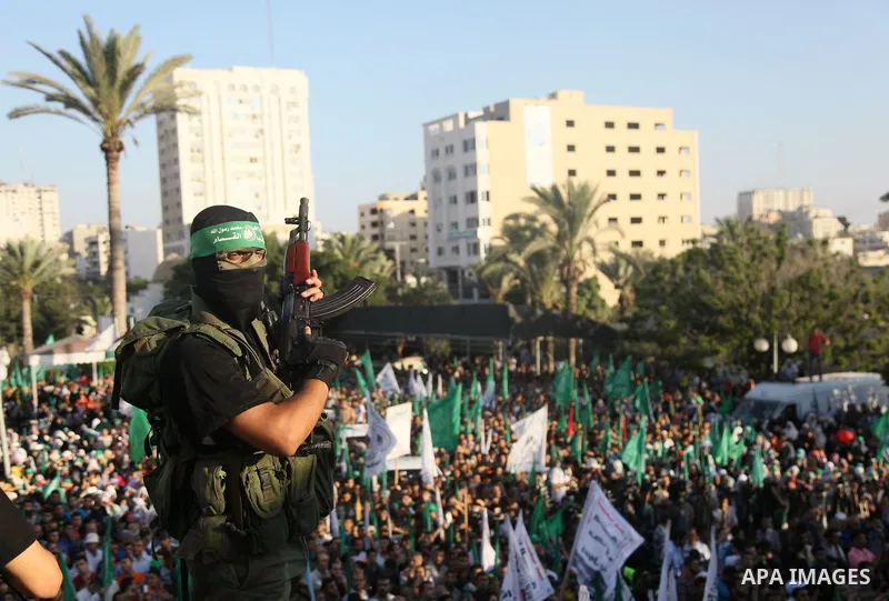 Palestinian militants from the Ezzedine al-Qassam Brigades, Hamas' armed wing, attend a rally in Gaza City on August 27, 2014, following a deal hailed by Israel and the Islamist movement as 'victory' in the 50-day war. T...