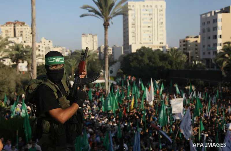 Palestinian militants from the Ezzedine al-Qassam Brigades, Hamas' armed wing, attend a rally in Gaza City on August 27, 2014, following a deal hailed by Israel and the Islamist movement as 'victory' in the 50-day war. T...
