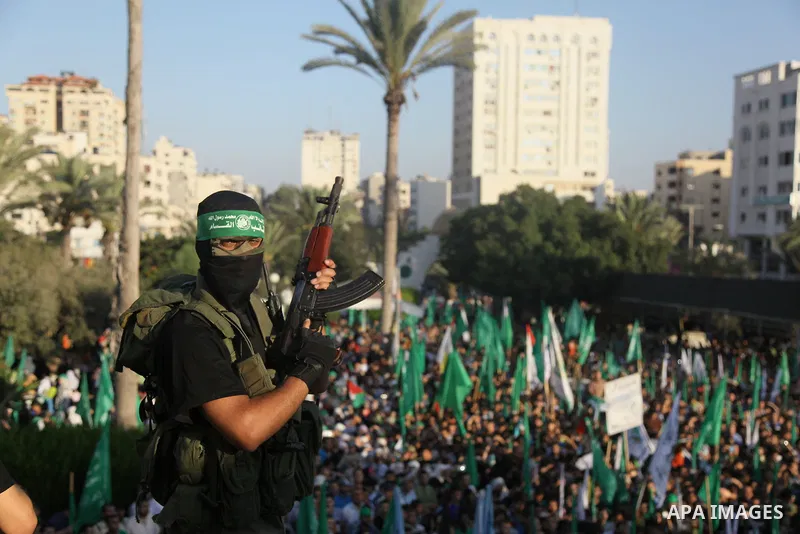Palestinian militants from the Ezzedine al-Qassam Brigades, Hamas' armed wing, attend a rally in Gaza City on August 27, 2014, following a deal hailed by Israel and the Islamist movement as 'victory' in the 50-day war. T...