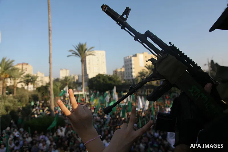 Palestinian militants from the Ezzedine al-Qassam Brigades, Hamas' armed wing, attend a rally in Gaza City on August 27, 2014, following a deal hailed by Israel and the Islamist movement as 'victory' in the 50-day war. T...
