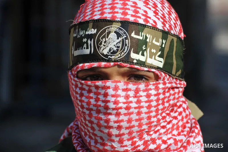 Palestinians Hamas supporters celebrate with people a victory over Israel, in Gaza City August 27, 2014. An open-ended ceasefire in the Gaza war held on Wednesday as Prime Minister Benjamin Netanyahu faced strong critici...