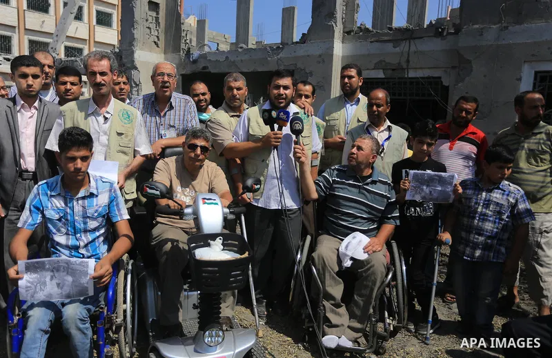 Palestinians take part a rally in front of a rehabilitation centre, in Gaza city August 28, 2014. Israel and Palestinians both boasted of victory in the Gaza war but analysts say Hamas received only promises while the co...