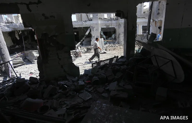A Palestinian man walks past the rubble of the destroyed a rehabilitation centre, in Gaza city August 28, 2014. Israel and Palestinians both boasted of victory in the Gaza war but analysts say Hamas received only promise...