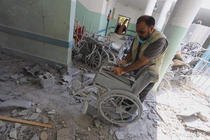 A Palestinian man inspects the rubble of the destroyed a rehabilitation centre, in Gaza city August 28, 2014. Israel and Palestinians both boasted of victory in the Gaza war but analysts say Hamas received only promises...