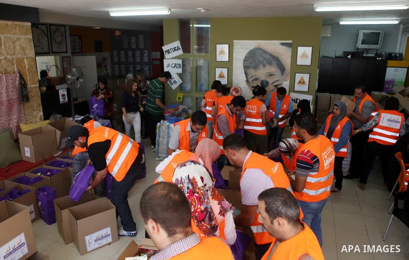 Palestinians collect human supplies to be sent to the stricken in the Gaza Strip in the West Bank city of Ramallah on August 28, 2014. Israel and Palestinians both boasted of victory in the Gaza war but analysts say Hama...