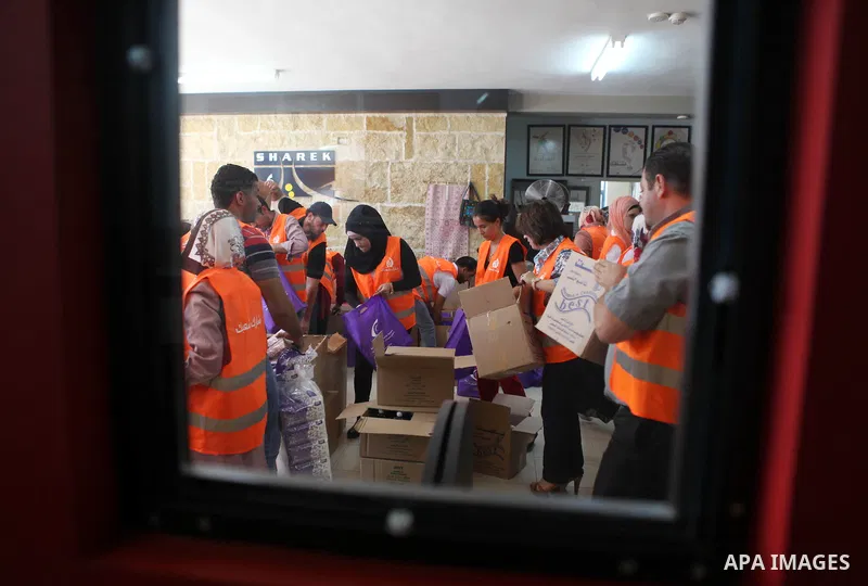 Palestinians collect human supplies to be sent to the stricken in the Gaza Strip in the West Bank city of Ramallah on August 28, 2014. Israel and Palestinians both boasted of victory in the Gaza war but analysts say Hama...