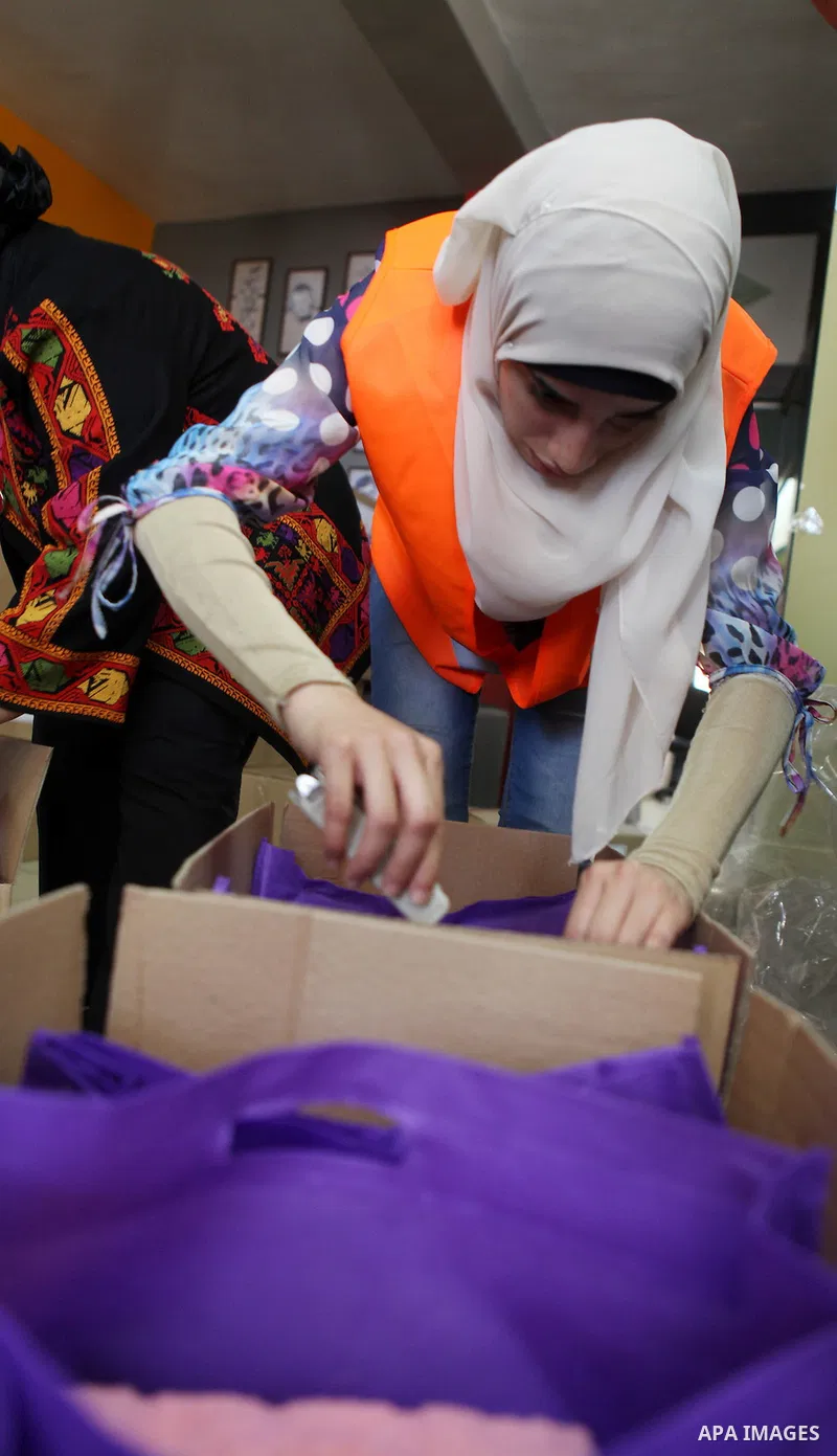 Palestinians collect human supplies to be sent to the stricken in the Gaza Strip in the West Bank city of Ramallah on August 28, 2014. Israel and Palestinians both boasted of victory in the Gaza war but analysts say Hama...