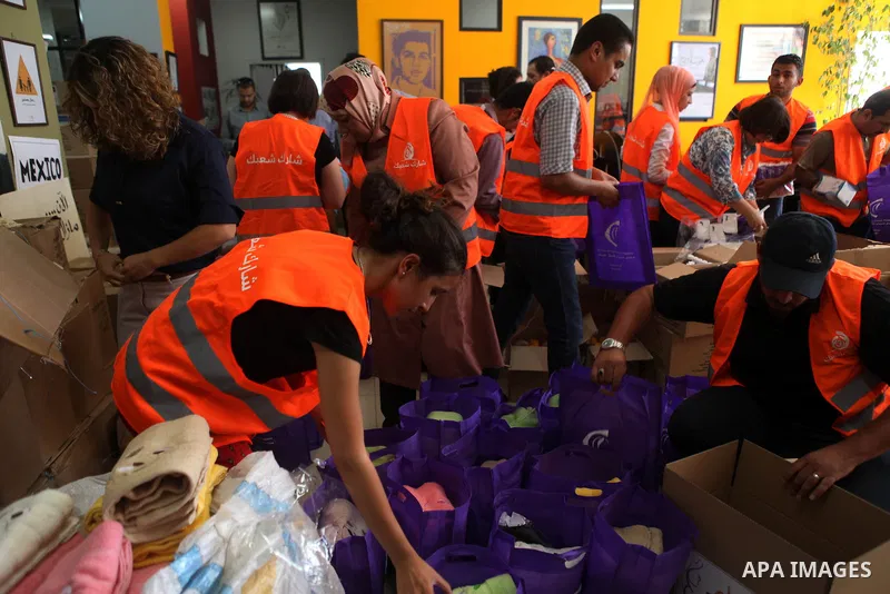 Palestinians collect human supplies to be sent to the stricken in the Gaza Strip in the West Bank city of Ramallah on August 28, 2014. Israel and Palestinians both boasted of victory in the Gaza war but analysts say Hama...