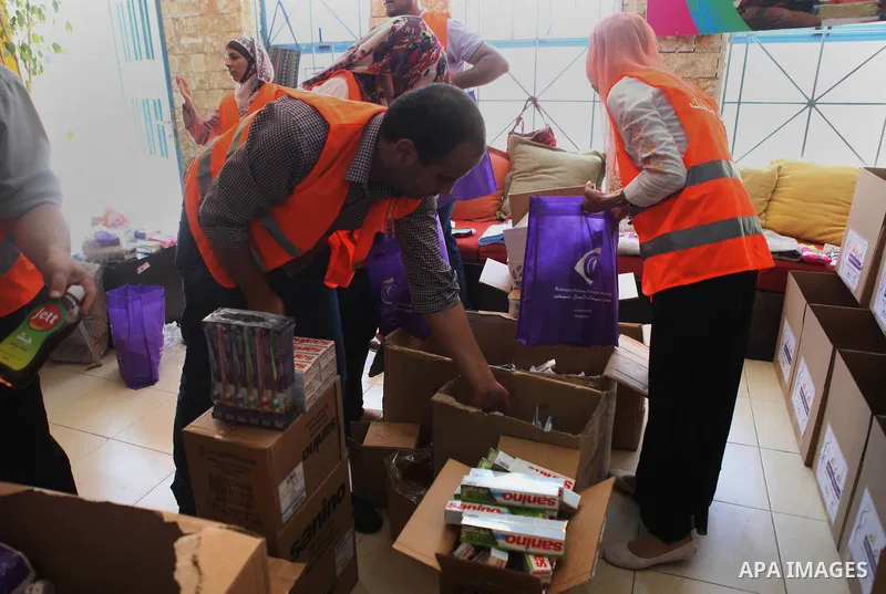Palestinians collect human supplies to be sent to the stricken in the Gaza Strip in the West Bank city of Ramallah on August 28, 2014. Israel and Palestinians both boasted of victory in the Gaza war but analysts say Hama...
