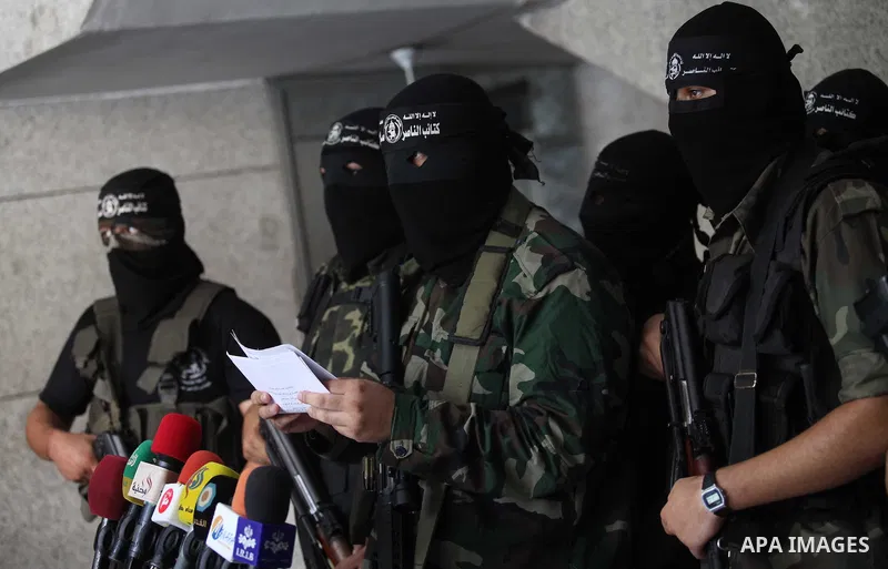 Palestinian Militants from al-Nasser Salah el dein brigades attend a press conference in Gaza city on August 28, 2014. An open-ended ceasefire in the Gaza war held on Wednesday as Prime Minister Benjamin Netanyahu faced...