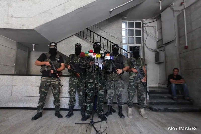 Palestinian Militants from al-Nasser Salah el dein brigades attend a press conference in Gaza city on August 28, 2014. An open-ended ceasefire in the Gaza war held on Wednesday as Prime Minister Benjamin Netanyahu faced...