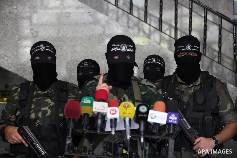 Palestinian Militants from al-Nasser Salah el dein brigades attend a press conference in Gaza city on August 28, 2014. An open-ended ceasefire in the Gaza war held on Wednesday as Prime Minister Benjamin Netanyahu faced...