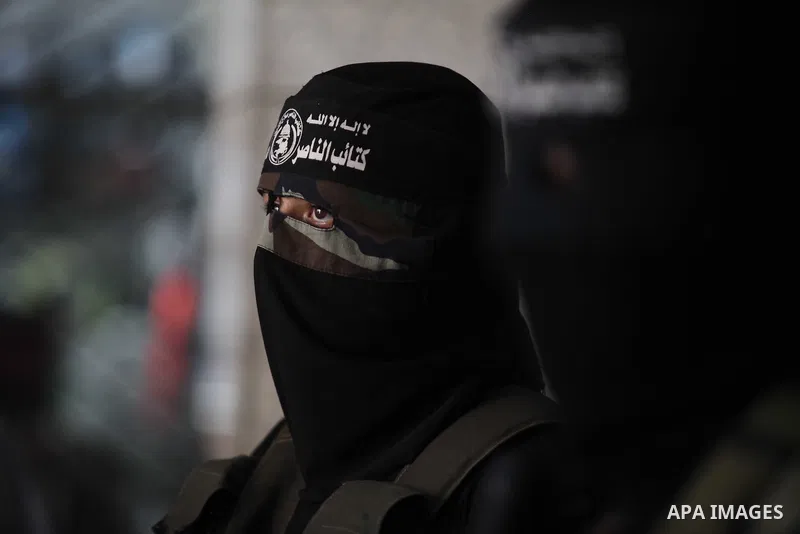 A Palestinian Militant from al-Nasser Salah el dein brigades attends a press conference in Gaza city on August 28, 2014. An open-ended ceasefire in the Gaza war held on Wednesday as Prime Minister Benjamin Netanyahu face...