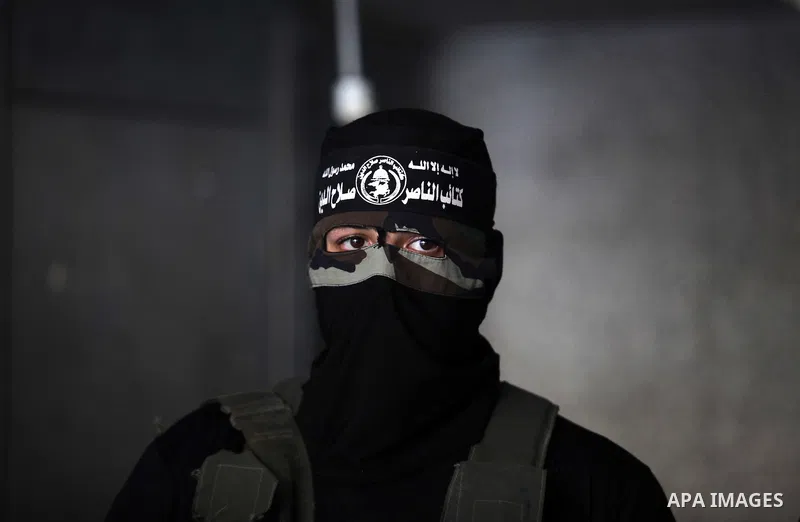A Palestinian Militant from al-Nasser Salah el dein brigades attends a press conference in Gaza city on August 28, 2014. An open-ended ceasefire in the Gaza war held on Wednesday as Prime Minister Benjamin Netanyahu face...