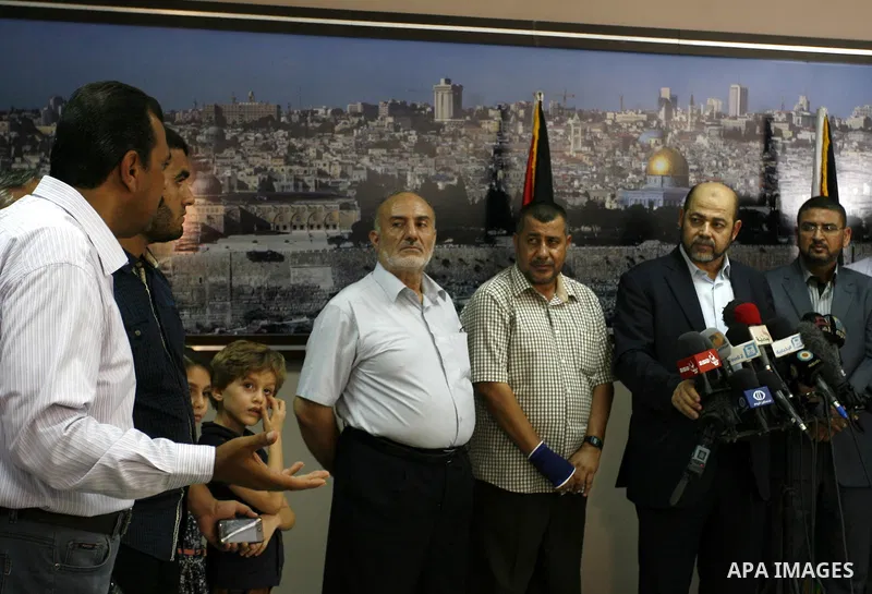 Senior Hamas official, Moussa Abu Marzouk speaks to media in Rafah crossing in the southern Gaza strip after the negotiations in Cairo, on August 28, 2014. An open-ended ceasefire in the Gaza war held on Wednesday as Pri...